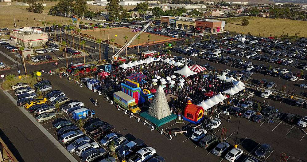 Rialto Marketplace Grand Opening with Vendor Tents and Kids Play Area