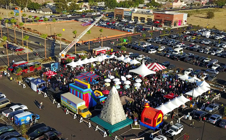 Rialto Marketplace Grand Opening with Vendor Tents and Kids Play Area
