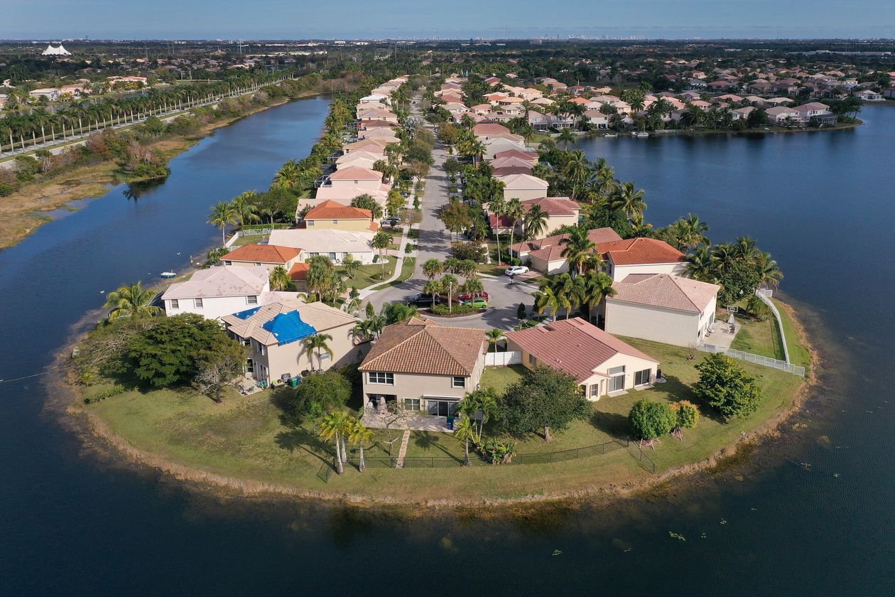 Aerial view of houses along waterway